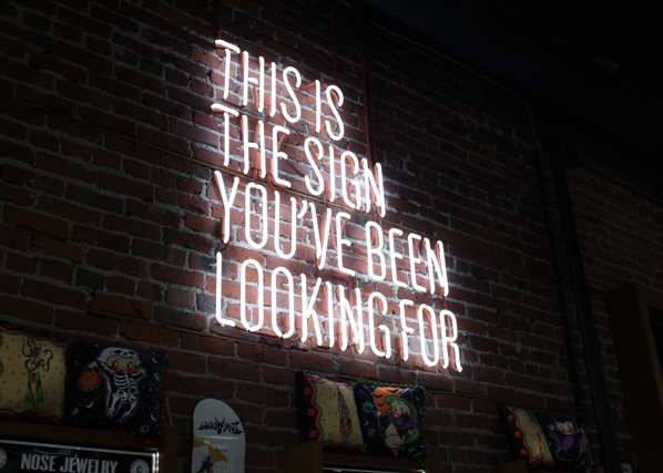 Neon sign calling signaling to clients with career issues that this is the time to act
