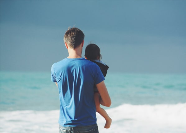 Father and daughter at the beach after a parenting support session at MindSol Wellness Center in Sarasota, Florida