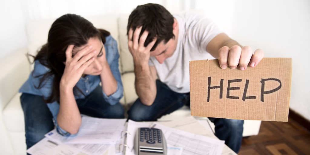 Photo of a couple experiencing financial hardship seeking help through counseling at MindSol Wellness Center in Sarasota, Florida