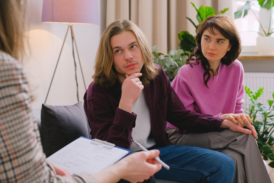 A couple holding hands during a couples therapy session