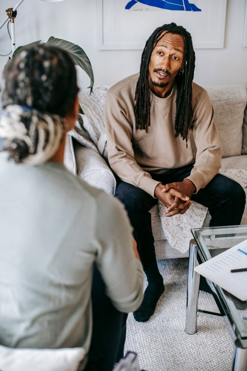 A man talking openly with his therapist during an individual therapy session